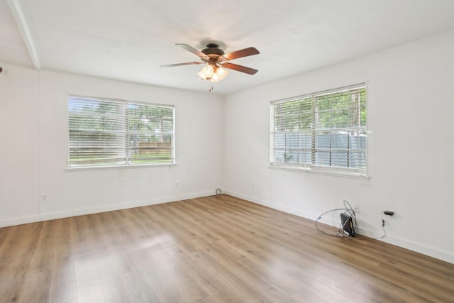 2112 Leyte Dr, Tool, TX 75143 - empty room with healthy amount of natural light, wood finished floors, and ceiling fan