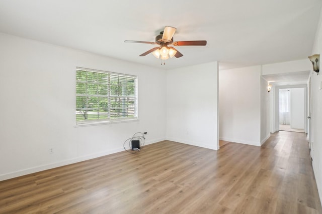 2112 Leyte Dr, Tool, TX 75143 - unfurnished room featuring a ceiling fan, light wood-type flooring, and baseboards