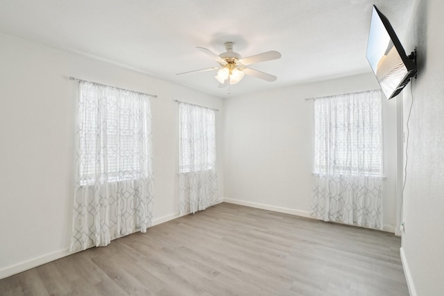 2112 Leyte Dr, Tool, TX 75143 - empty room with wood finished floors, ceiling fan, and baseboards