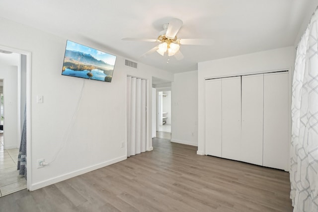 2112 Leyte Dr, Tool, TX 75143 - unfurnished bedroom featuring wood finished floors, a ceiling fan, and baseboards