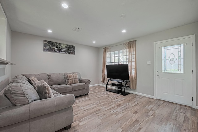 6134 Guadalupe St, Houston, TX 77016 - living area with light wood-style floors, recessed lighting, and baseboards