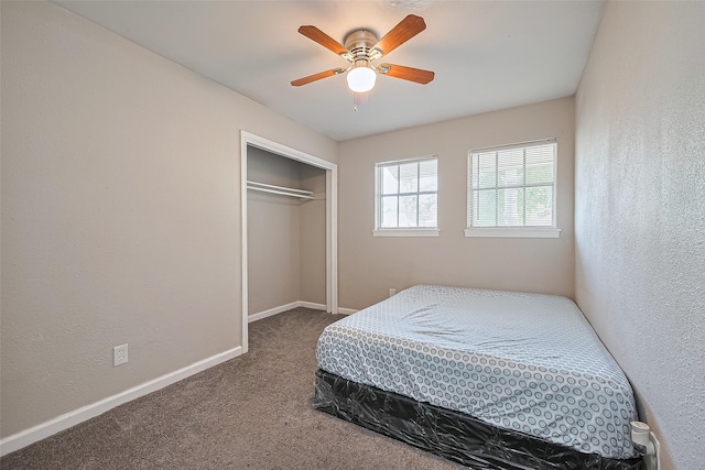6134 Guadalupe St, Houston, TX 77016 - bedroom featuring carpet floors, a closet, baseboards, and a ceiling fan
