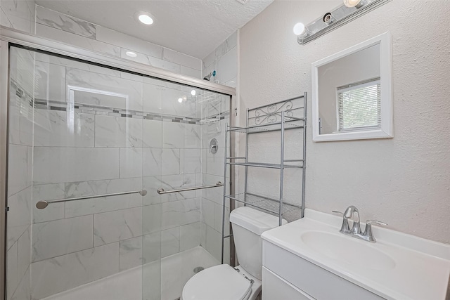 6134 Guadalupe St, Houston, TX 77016 - full bath with toilet, a shower stall, vanity, recessed lighting, and a textured wall