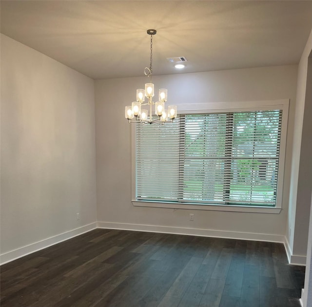 3522 Stonehenge, Montgomery, TX 77356 - spare room featuring a chandelier, baseboards, and dark wood finished floors