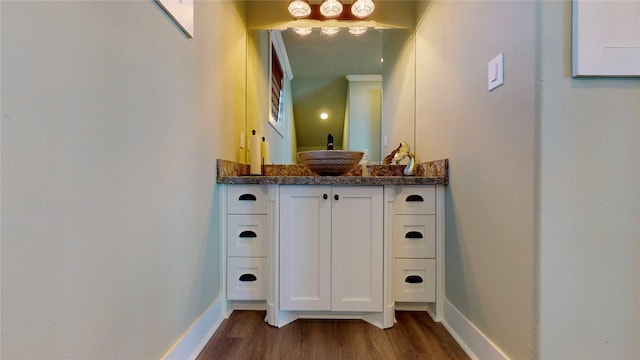 2414 Sand Drift Ln, Crystal Beach, TX 77650 - bathroom featuring wood finished floors, vanity, and baseboards