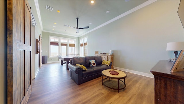2414 Sand Drift Ln, Crystal Beach, TX 77650 - living area with baseboards, wood finished floors, crown molding, a ceiling fan, and recessed lighting