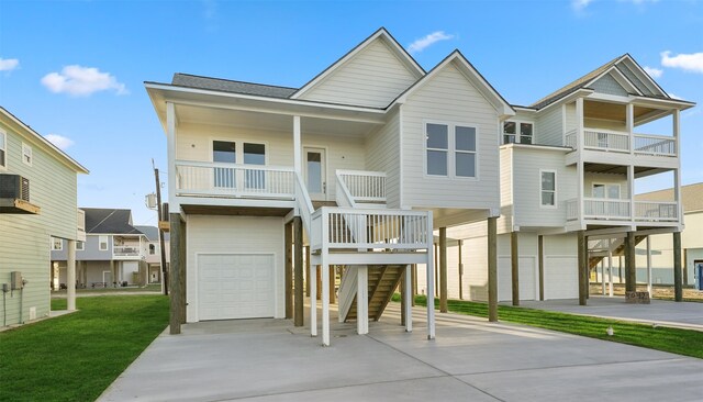 4046 Miramar Ct, Galveston, TX 77554 - beach home featuring driveway, stairway, an attached garage, and a front yard