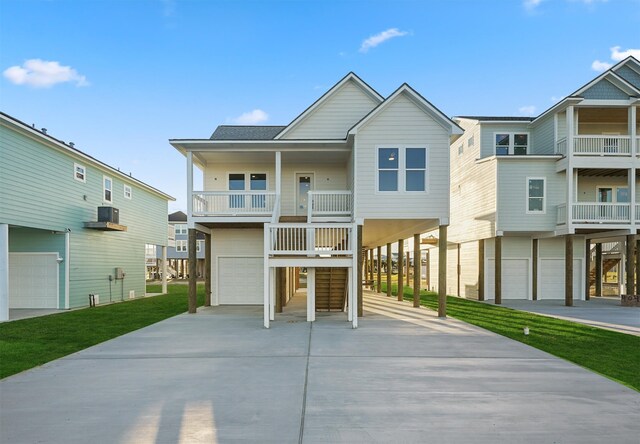 4046 Miramar Ct, Galveston, TX 77554 - coastal home with an attached garage and concrete driveway