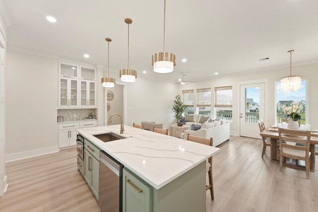 4046 Miramar Ct, Galveston, TX 77554 - kitchen featuring a sink, dishwasher, recessed lighting, light wood-type flooring, and white cabinetry
