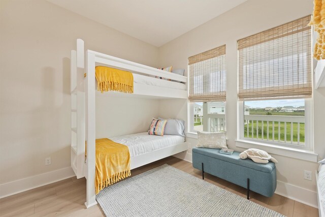 4046 Miramar Ct, Galveston, TX 77554 - bedroom with baseboards and wood finished floors