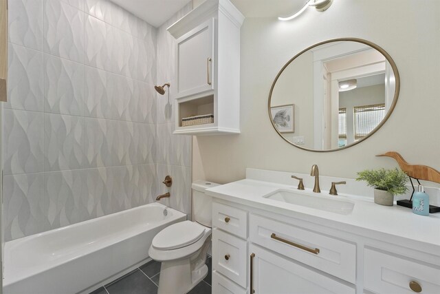 4046 Miramar Ct, Galveston, TX 77554 - bathroom with vanity, toilet, tile patterned floors, and washtub / shower combination