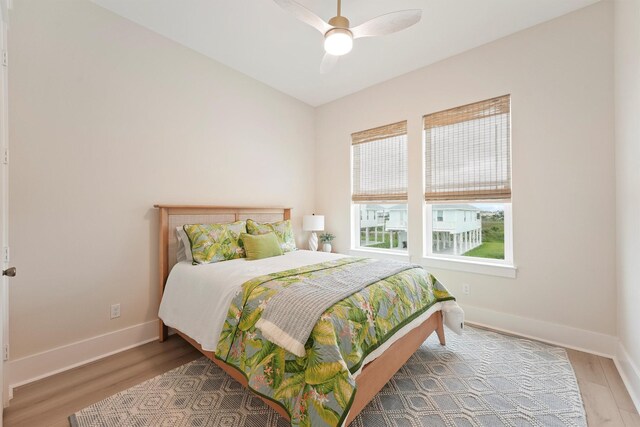 4046 Miramar Ct, Galveston, TX 77554 - bedroom featuring wood finished floors, baseboards, and ceiling fan