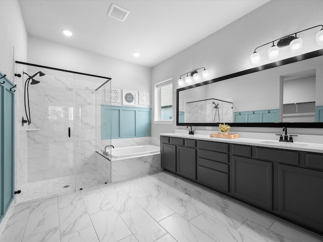17511 Autumn Leaves Dr, Conroe, TX 77302 - full bathroom featuring marble finish flooring, a bath, a marble finish shower, and double vanity