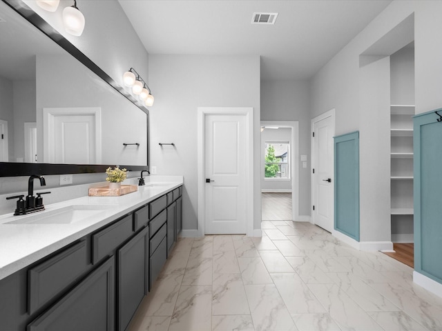 17511 Autumn Leaves Dr, Conroe, TX 77302 - full bathroom featuring marble look tiles, double vanity, baseboards, and a closet