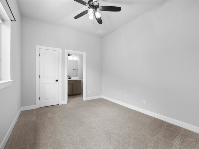 17511 Autumn Leaves Dr, Conroe, TX 77302 - unfurnished bedroom with light carpet, baseboards, connected bathroom, and ceiling fan