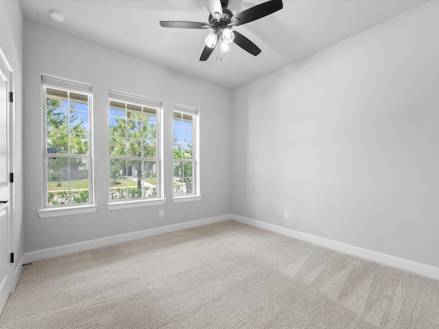 17511 Autumn Leaves Dr, Conroe, TX 77302 - unfurnished room featuring light carpet, baseboards, and a ceiling fan