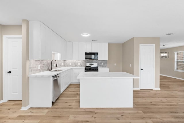 19222 Wading River Dr, Tomball, TX 77375 - kitchen with appliances with stainless steel finishes, a sink, baseboards, and tasteful backsplash