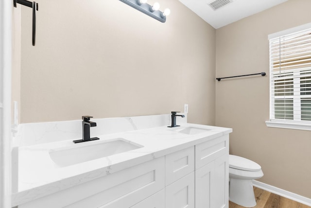 19222 Wading River Dr, Tomball, TX 77375 - bathroom with toilet, wood finished floors, double vanity, and plenty of natural light