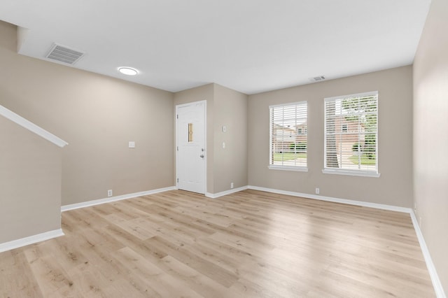 19222 Wading River Dr, Tomball, TX 77375 - foyer entrance with light wood-style floors and baseboards