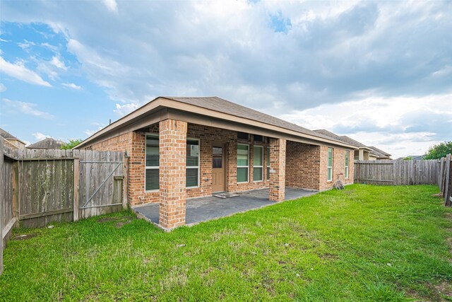 3423 Single Ridge Way, Katy, TX 77493 - rear view of house featuring brick siding and a patio