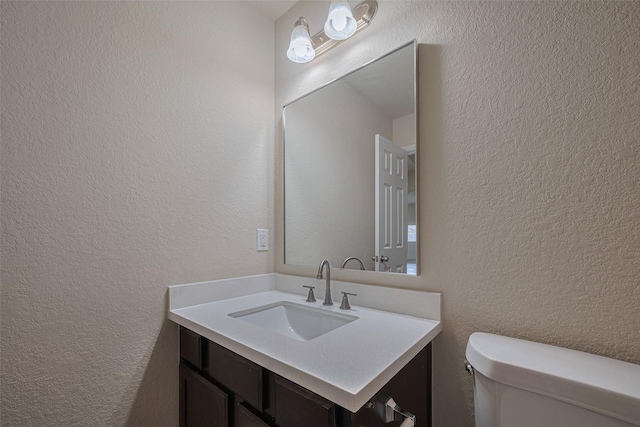 3423 Single Ridge Way, Katy, TX 77493 - bathroom with a textured wall, vanity, and toilet