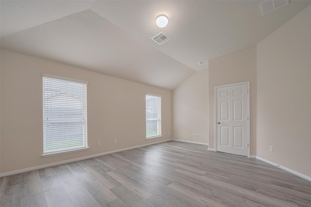 3423 Single Ridge Way, Katy, TX 77493 - unfurnished room with lofted ceiling, wood finished floors, and baseboards