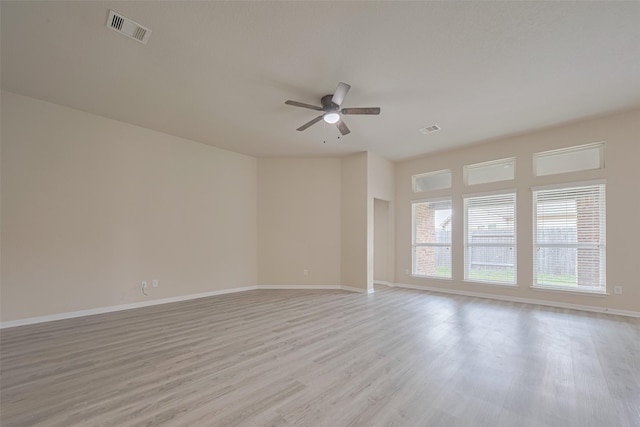 3423 Single Ridge Way, Katy, TX 77493 - empty room featuring ceiling fan, light wood-style floors, and baseboards