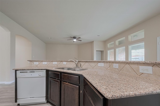 3423 Single Ridge Way, Katy, TX 77493 - kitchen with white dishwasher, a sink, tasteful backsplash, ceiling fan, and dark brown cabinets