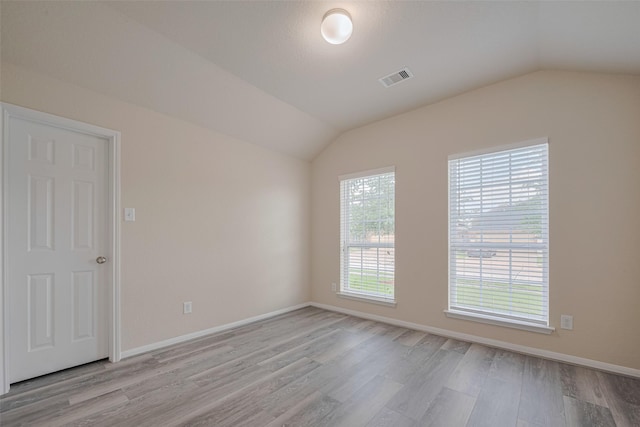 3423 Single Ridge Way, Katy, TX 77493 - unfurnished room featuring lofted ceiling, light wood-style flooring, and baseboards