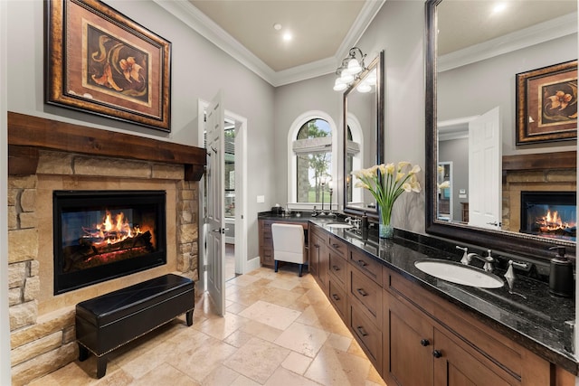 2722 N Southern Oaks Dr, Houston, TX 77068 - full bathroom featuring a fireplace, double vanity, crown molding, stone tile flooring, and recessed lighting