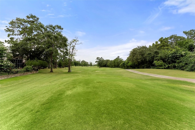 2722 N Southern Oaks Dr, Houston, TX 77068 - view of property's community featuring view of golf course, a yard, and view of wooded area
