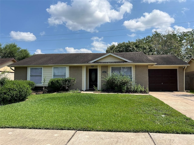 2503 Ironclad Dr, League City, TX 77573 - single story home featuring an attached garage, a front yard, concrete driveway, and brick siding