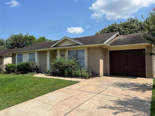 2503 Ironclad Dr, League City, TX 77573 - single story home with brick siding, a garage, driveway, and a front lawn