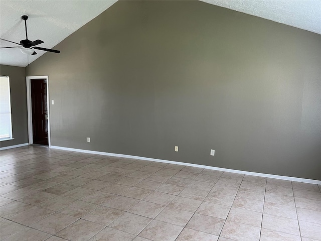 2503 Ironclad Dr, League City, TX 77573 - empty room featuring a textured ceiling, lofted ceiling, light tile patterned flooring, ceiling fan, and baseboards