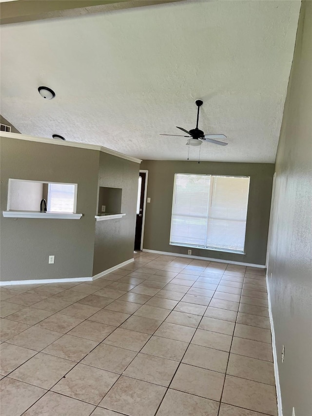 2503 Ironclad Dr, League City, TX 77573 - unfurnished room with light tile patterned flooring, healthy amount of natural light, a ceiling fan, a textured ceiling, and baseboards
