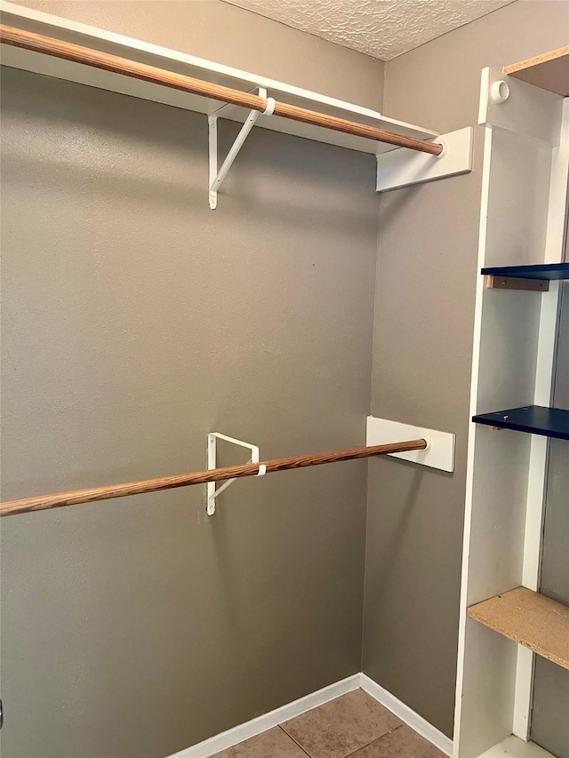 2503 Ironclad Dr, League City, TX 77573 - spacious closet with tile patterned flooring