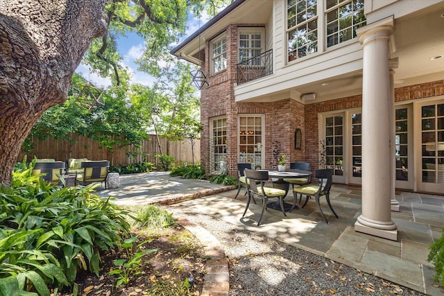 3428 Wickersham Ln, Houston, TX 77027 - view of patio featuring french doors and a balcony