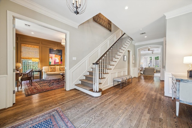 3428 Wickersham Ln, Houston, TX 77027 - foyer featuring a decorative wall, wood finished floors, crown molding, stairs, and recessed lighting