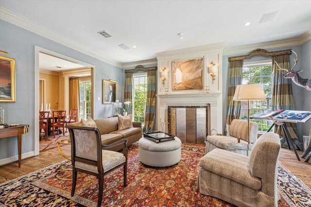 3428 Wickersham Ln, Houston, TX 77027 - living area featuring a fireplace, wood finished floors, and ornamental molding