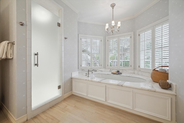 3428 Wickersham Ln, Houston, TX 77027 - full bath featuring wood finished floors, a stall shower, a chandelier, crown molding, and a garden tub