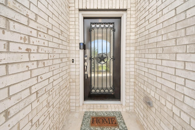 8034 Royal Palm Dr, Fulshear, TX 77441 - doorway to property with brick siding