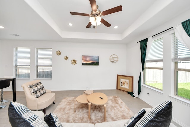 8034 Royal Palm Dr, Fulshear, TX 77441 - living area featuring a ceiling fan, a raised ceiling, baseboards, and recessed lighting