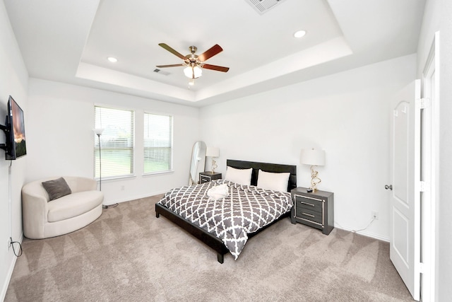 8034 Royal Palm Dr, Fulshear, TX 77441 - carpeted bedroom featuring a tray ceiling, baseboards, recessed lighting, and ceiling fan