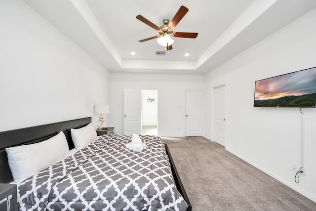 8034 Royal Palm Dr, Fulshear, TX 77441 - carpeted bedroom with recessed lighting, a raised ceiling, baseboards, and a ceiling fan