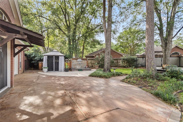 4206 Misty Timbers Way, Houston, TX 77345 - fenced backyard featuring a gazebo and a patio