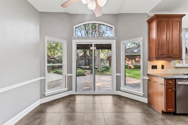 4206 Misty Timbers Way, Houston, TX 77345 - doorway featuring healthy amount of natural light, tile patterned flooring, ceiling fan, and baseboards