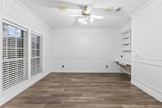 4206 Misty Timbers Way, Houston, TX 77345 - unfurnished dining area with a decorative wall, ornamental molding, ceiling fan, and dark wood finished floors