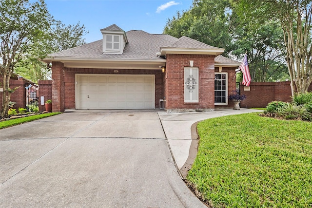 4206 Misty Timbers Way, Houston, TX 77345 - view of front of property featuring a garage, a shingled roof, brick siding, and driveway