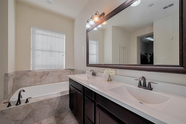 27003 Lindenwood Creek Ln, Katy, TX 77494 - full bathroom featuring double vanity, a bath, and a spacious closet