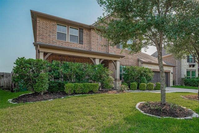 27003 Lindenwood Creek Ln, Katy, TX 77494 - traditional-style home featuring brick siding, a front lawn, driveway, and a garage